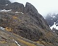 Douglas Boulder (Ben Nevis, Highland Scotland) and East Gully in May 2014 with cloud in background and a few snowpatches.jpg