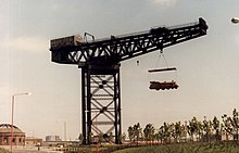 The Finnieston Crane in 1987 holding the straw locomotive sculpted by George Wyllie Finnieston Crane holding the Straw Locomotive.jpg