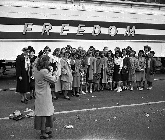 The Susan B. Anthony Club of Los Angeles gathers for a photograph in front of the Freedom Train in February 1948