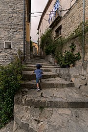 Gabriel climbs a flight of stairs, Castelmezzano, Italy