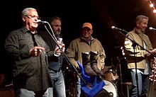 Vaqueros del Mar 5, George Strait auctions off his boots for the troops: George Strait, Tom Cusick, David Feherty