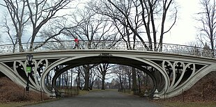 Cast-iron Gothic tracery supports a bridge by Calvert Vaux, in Central Park, New York City Gothic Bridge 28 east cloudy jeh.jpg