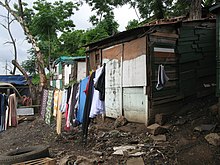 Informal settlement in Durban Informal settlement where people now have community ablution blocks (8152040443).jpg