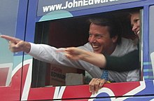 John Edwards and wife Elizabeth greet supporters while arriving to the debate in his campaign bus John Edwards Arrives at Drake University for the 1st Democratic Presidential Debate in Iowa (1170485769) (cropped).jpg