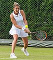 Julie Coin competing in the first round of the 2015 Wimbledon Qualifying Tournament at the Bank of England Sports Grounds in Roehampton, England. The winners of three rounds of competition qualify for the main draw of Wimbledon the following week.