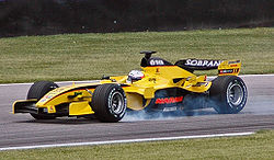 Narain Karthikeyan driving for Midland owned Jordan at the 2005 United States Grand Prix. Karthikeyan (Jordan) locking brakes in qualifying at USGP 2005.jpg