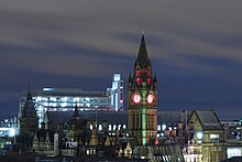 View across the rooftops by night, from the north-west Manchester Town Hall by night from Renaissance Hotel.JPG