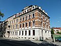 Apartment building in half-open development