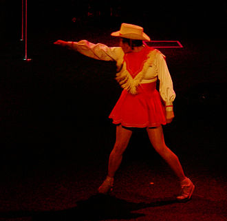 Kara O'Toole dancing in an excerpt from Graney's Jesus Loves the Little Cowgirls as part of a celebration of the 100th anniversary of Seattle's Moore Theatre. Moore Theatre 100 Years - Kara O'Toole 07A.jpg