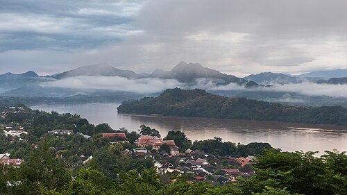 Mountains clouds Mekong and dwellings from Mount Phou Si at sunrise in Luang Prabang Laos