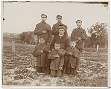 Teacher and young boys posed for photograph Native American boarding school-Teacher and young boys posed for photograph.jpg