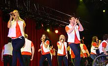 Glee Cast performing the song during Glee Live! In Concert! New Directions Don't Stop Believin'.jpg