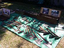 A collection of old Australian cutting tools including broad axes, broad hatchets, mortising axes, carpenter's and felling axes. Also five adzes, a corner chisel, two froes, and a twybil. Old axes.jpg