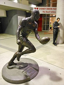 Statue of Paul Kelly at the SCG. Kelly, a New South Welshman, known as "captain courageous" he was one of Sydney's longest serving skippers captaining the side between 1993 and 2002. Paul Kelly (the footballer) (7176553482).jpg