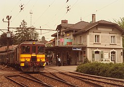 Station with passenger train (likely before June 1984)