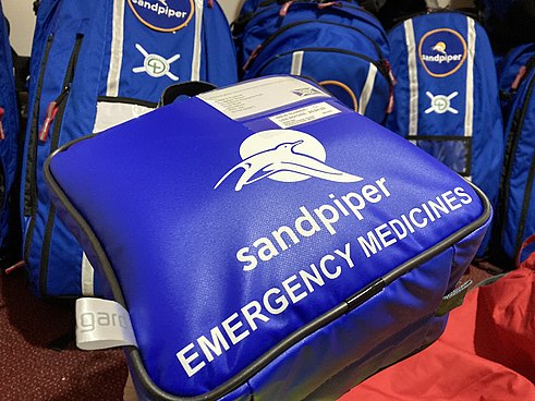 The Sandpiper emergency medicines pouch with Sandpiper Bags in the background Sandpiper Drug Pouch.jpg