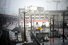 Coast Guard District 13 headquarters, Pier 36/37, from the north. Coast Guard Museum (1925) in front, then the former Pacific Steamship Company building (1925), then the warehouse (1941) that is an early example of Brutalist architecture. Seattle - Coast Guard Station from Alaskan Way Viaduct 01 - equalized.jpg