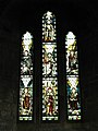 七大天使長，薩基爾位於左下方，祂左手持頂部飾以花朶的權杖，右手持小號。花窗玻璃，位於英國諾森伯蘭郡沃登（英语：Warden, Northumberland）的聖米迦勒暨諸天使堂。