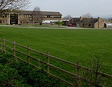 View of the south side of the school, looking over the playing field South side of Winchcombe School (geograph 4418531).jpg