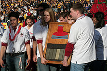 Stanford University's Axe Committee carries the Axe around Memorial Stadium during the 2008 Big Game Stanford Axe.jpg
