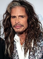 Steven Tyler, lead singer of the rock band Aerosmith, reached number one with his solo album We're All Somebody from Somewhere. Steven Tyler by Gage Skidmore 3.jpg