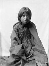 Edward S. Curtis, A Taos girl, three-quarter length portrait, seated, facing front, ca. 1905 Taos girl 3c06253u.jpg
