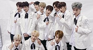 The Boyz wearing white suit posing for the camera