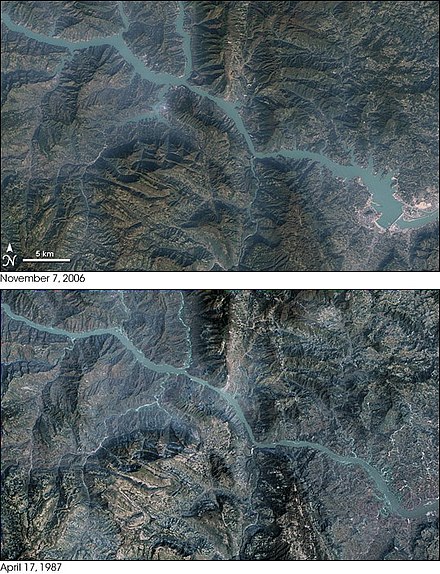 Satellite map showing areas flooded by the Three Gorges reservoir. Compare 7 November 2006 (above) with 17 April 1987 (below). The energy station required the flooding of archaeological and cultural sites and displaced some 1.3 million people, and is causing significant ecological changes, including an increased risk of landslides.[21] The dam has been a controversial topic both domestically and abroad.[22]