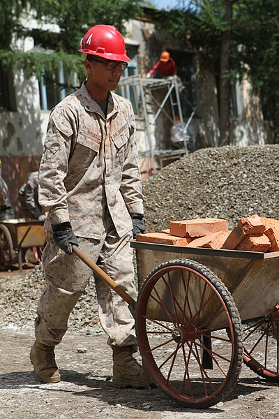 File:U.S. Marine Corps Lance Cpl. Josue A. Sirias, with the 9th Engineer Support Battalion, wheels bricks to another section of the job site during renovation work at Erdmiin Oyun High School in Nalaikh district 130721-M-DR618-111.jpg