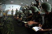 Indian soldiers assigned to the 9th Battalion of the Sikh Infantry take notes during small arms training aboard USS Boxer during Malabar 2006. US Navy 061026-N-0209M-005 Indian soldiers assigned to the 9th Battalion of the Sikh Infantry take notes during small arms training aboard USS Boxer (LHD 4) during Malabar 2006.jpg