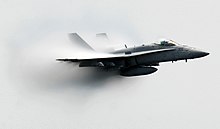 US Navy 070602-N-2984R-009 An F-A-18C Hornet assigned to the Strike Fighter Squadron (VFA) 37 performs a supersonic pass as part of the air power demonstration during the Friends and Family Day Cruise.jpg