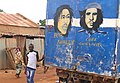 Young Man Poses with Bob Marley-Che(e) Guevara Mural on Back of Delivery Truck - Ouagadougou - Burkina Faso.jpg
