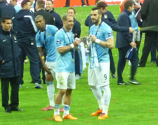 Pablo Zabaleta and Álvaro Negredo hold the League Cup trophy after City's victory in the Capital One Cup final.