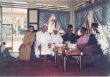 Zakaria with his father and relatives in 1990s Zakaria with Gamal and relatives.png