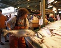 "Fish thrower" at the Pike Place Fish Company, Seattle, Washington LCCN2011634663.tif