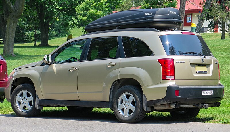 File:2007 Suzuki XL7 JX in Cool Beige Metallic, Rear Left, 06-22-2023.jpg