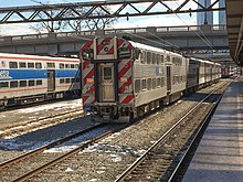Metra Highliner IIs, with the retired original Highliners in the background 20160212 20 Last Run of Metra Electric Highliners (28792378475).jpg