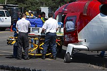 Patient being loaded into a medical helicopter Air Ambulance 6516.JPG
