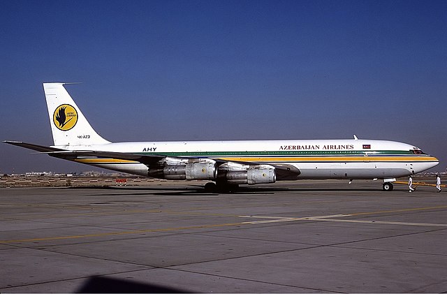 Azerbaijan Airlines Boeing 707-300 parked at a remote stand at Dubai International Airport in 1995