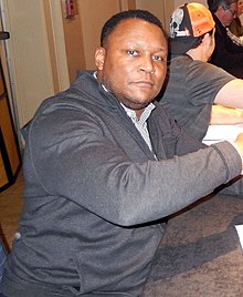 Running back Barry Sanders was drafted first overall in 1989. He spent his whole 10-year career with the Lions, during which time he was a 10-time All-Pro, 10-time Pro Bowler, two-time Offensive Player of the Year, and the 1997 MVP. A first-ballot Pro Football Hall of Famer, Sanders rushed for over 1,000 yards in every season he played and led the league in rushing yards four times. He was also selected to the NFL 100th Anniversary All-Time Team. Barry Sanders 2019.jpg