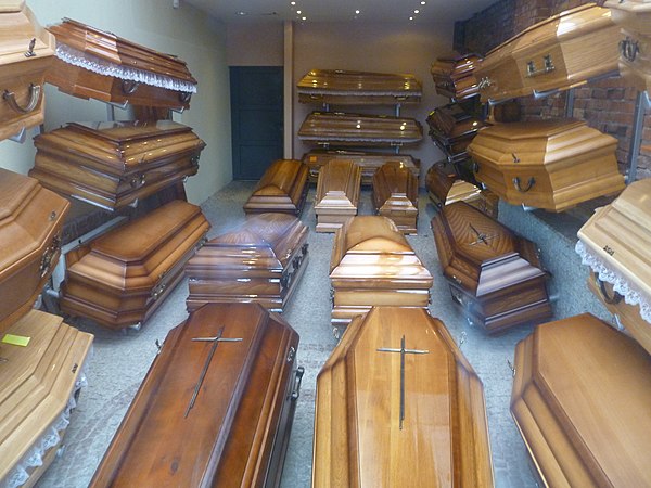 A shop window display of coffins at a Polish funeral director's office