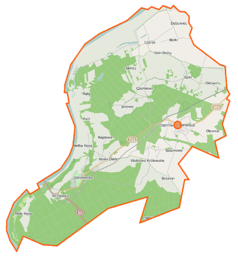 Mapa konturowa gminy Dąbrowa Chełmińska, u góry nieco na prawo znajduje się punkt z opisem „Czarże”