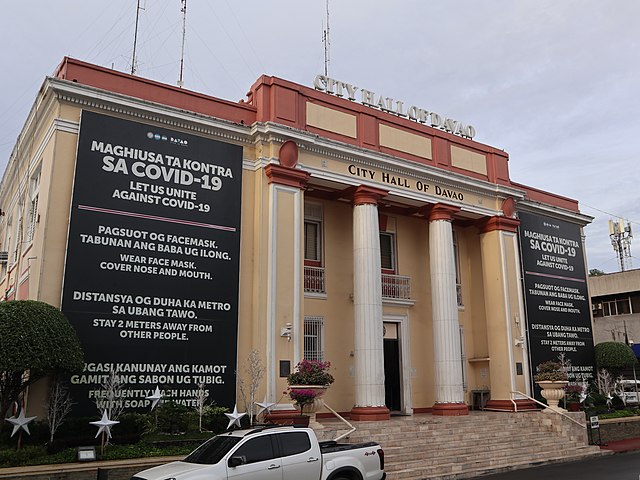 Public health safety reminders on the city hall of Davao