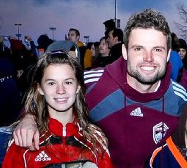 Drew posing with a fan at the 2010 MLS Cup celebration.