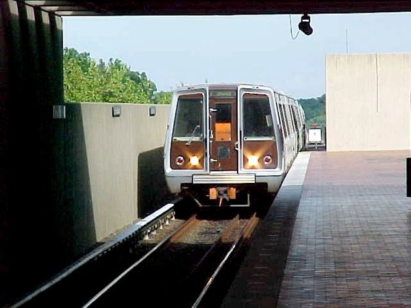 A Washington Metro train entering East Falls Church station