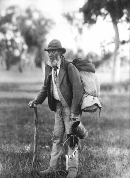 A "swagman" from Australia carrying a variation of the cowboy bedroll, called a "swag", ca. 1901