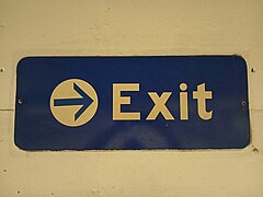 Exit signage on wall of former garage.jpg