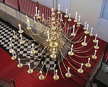 Use of brass hardware and chandeliers are common elements of Southern Colonial style as shown in the Georgetown Building. GTchandelier.jpg