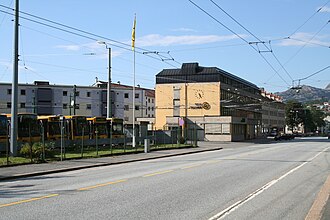 The Headquarters of Gaia Trafikk in Landas. Overhead electrical wires for the trolleybuses are visible above the road Gaia Trafikk HQ.JPG