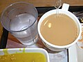 HK lunch 大家樂 Coral de Cafe cup of Milk Tea n boiled hot water June-2012.JPG